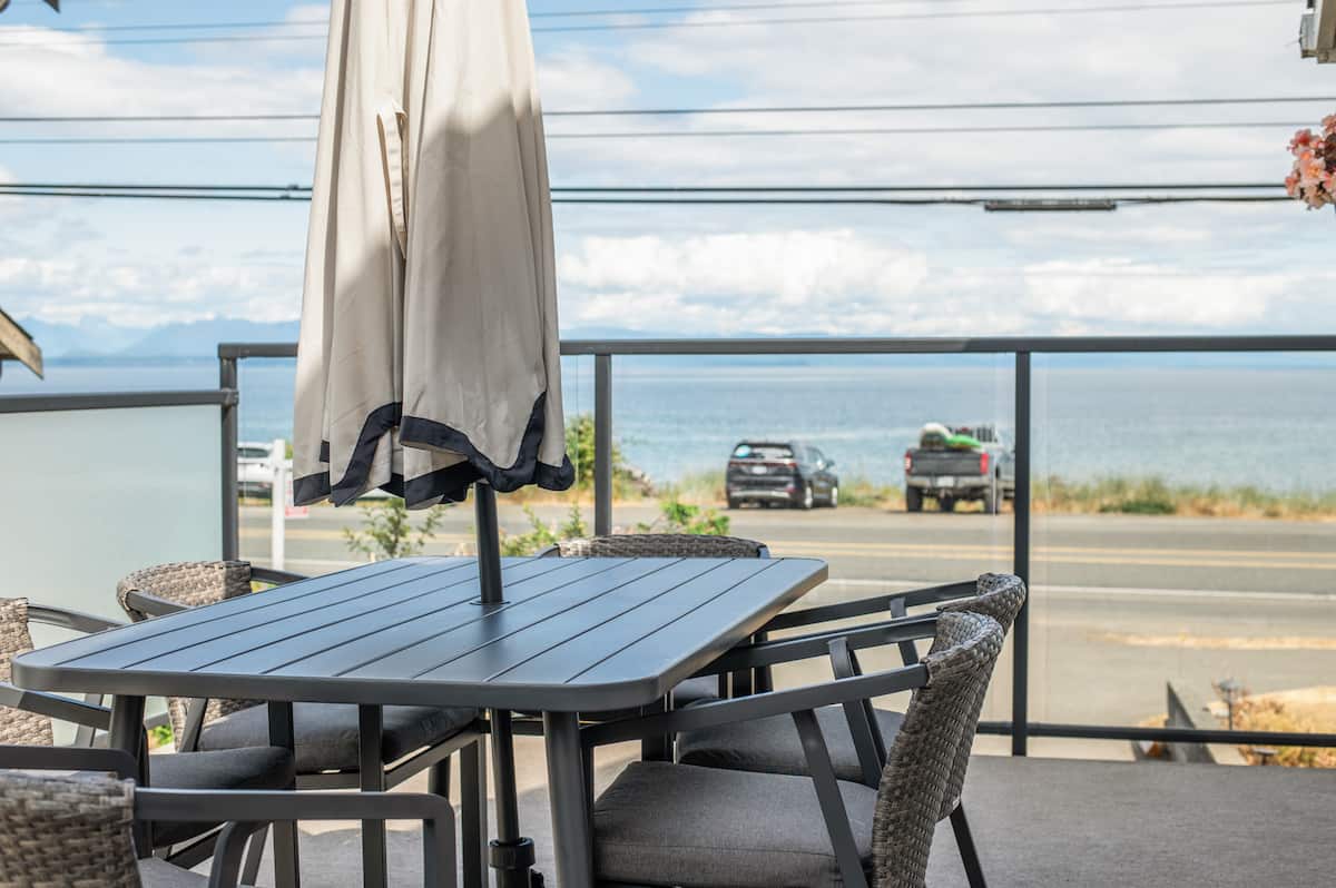 Front deck with outdoor dining and ocean view